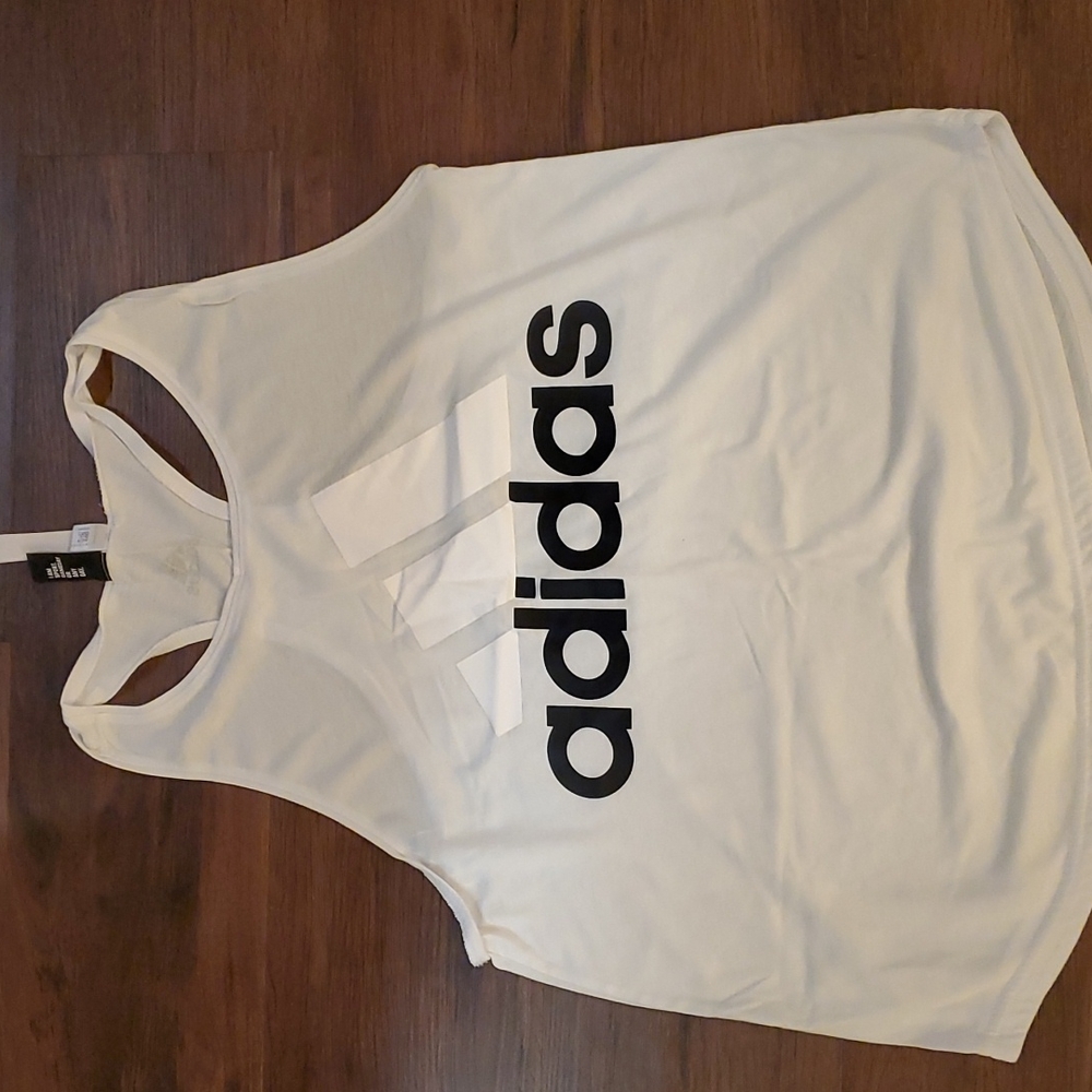 Three women's adidas workout tanks